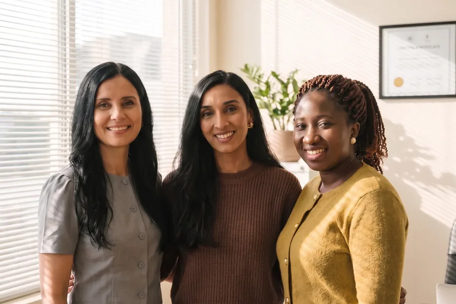 The three pharmacists standing together in the clinic